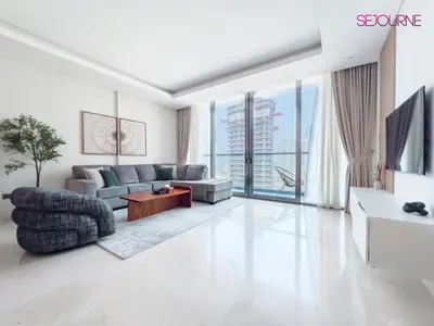 a living room with a couch and a table at #140 Elegant 1BR with Burj Khalifa View in Business Bay in Dubai