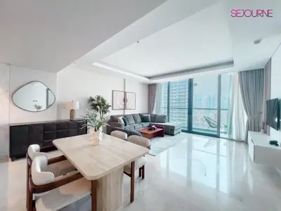 a living room with a table and a couch at #140 Elegant 1BR with Burj Khalifa View in Business Bay in Dubai
