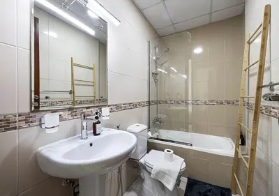 a bathroom with a sink and a toilet and a shower at Luxury home with stunning view in Dubai