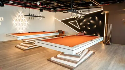 two snooker tables in a room withadobeadobe at Medore Entire Brand New Flat in Dubai in Dubai