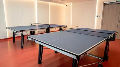 two ping pong tables in an empty room with at Medore High Floor Brand New Apartment - 27 in Dubai