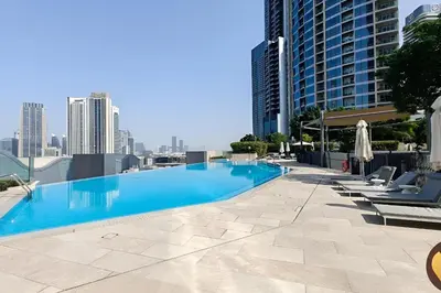 a large swimming pool on top of a building at Burj View Infinity Pool - Dubai Mall Connection in Dubai