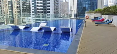 a swimming pool on the roof of a building at Bayz by Danube Marasi Drive in Dubai