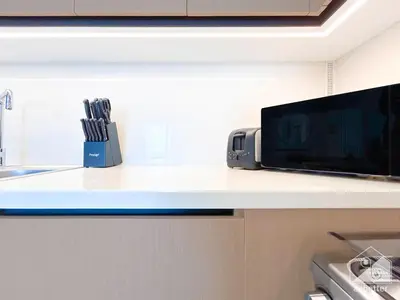 a kitchen counter with a microwave and a radio at Luxury Burj Crown Downtown Balcony & View in Dubai