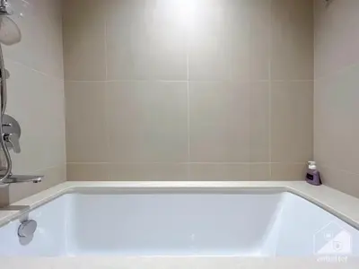 a white bath tub in a bathroom with a sink at Luxury Burj Crown Downtown Balcony & View in Dubai