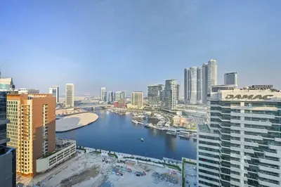 a view of a river in a city with buildings at Stunning Canal Views l Sleeps 6 in Dubai