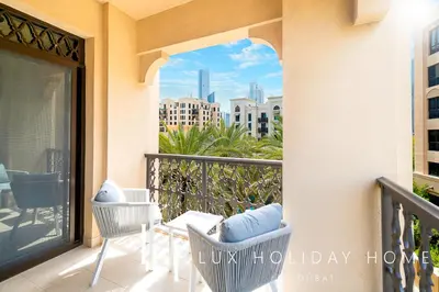 a balcony with a view of a city at LUX The Burj Khalifa View Downtown Suite in Dubai