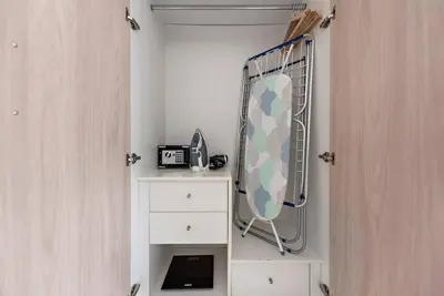 a dressing room with a mirror and a dresser at Studio -DEC Towers T2 - Near Marina Beach in Dubai