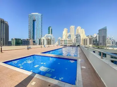 a large swimming pool on the roof of a building at Studio -DEC Towers T2 - Near Marina Beach in Dubai