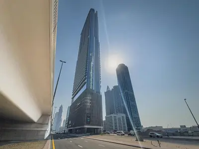 a view of a city with tall buildings at Escape24 Spacious 2BR Infinity Pool with Burj Views in Dubai