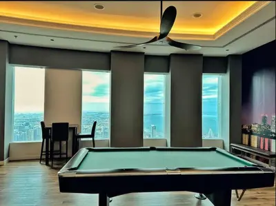 a billiard table in a room with a view at Breathtaking 2BR with Full SeaView in Dubai