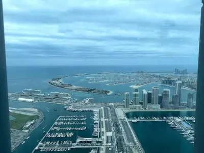 an aerial view of a city with a harbor and boats at Breathtaking 2BR with Full SeaView in Dubai