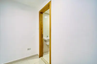 a bathroom with a toilet and a mirror at ShoresInn - Outdoor Retreat with Private Terrace in Dubai