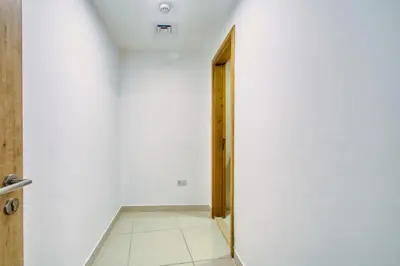 an empty corridor with a door in a room at ShoresInn - Outdoor Retreat with Private Terrace in Dubai