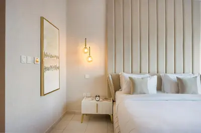 a hotel room with a bed and a mirror at Durrani Homes - Grand 03 in Dubai