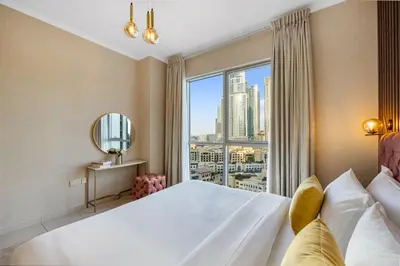 a bedroom with a large bed and a large window at Durrani Homes - Grand 03 in Dubai