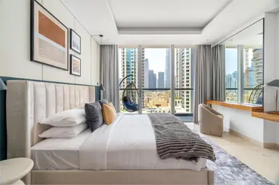 a bedroom with a large bed and a large window at GuestReady - Modern retreat in Business Bay in Dubai