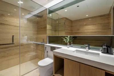 a bathroom with a sink and a toilet and a shower at GuestReady - Modern retreat in Business Bay in Dubai