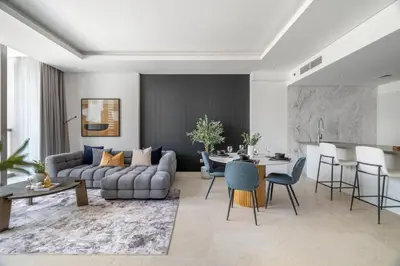 a living room with a couch and a table at GuestReady - Modern retreat in Business Bay in Dubai