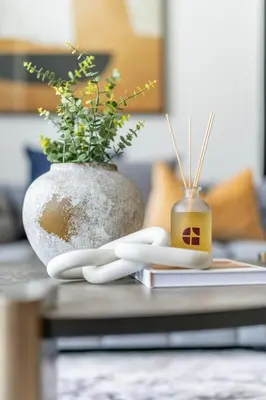 a vase with a plant in it on a table at GuestReady - Modern retreat in Business Bay in Dubai