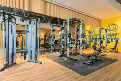 a gym with several tread machines in a room at Palm Jumeirah Seven Palm 1 Bedroom with infinity pool and Palm jumeirah beach in Dubai