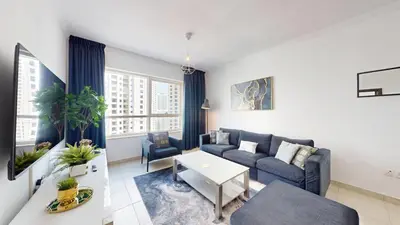 a living room with a couch and a table at Marina Quays - Calm One Bedroom in Dubai
