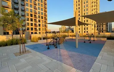 a playground in a city with buildings at Luxury Apt in Dubai Hills Burj Khalifa views in Dubai
