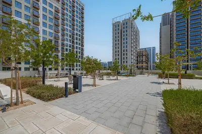 a sidewalk in a city with tall buildings at Luxury Apt in Dubai Hills Burj Khalifa views in Dubai