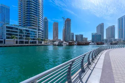 a view of a river in a city with tall buildings at Walk to JBR Beach I Marina Studio Stay I Wi-fi in Dubai