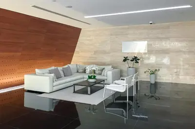 a living room with a white couch and a table at Walk to JBR Beach I Marina Studio Stay I Wi-fi in Dubai