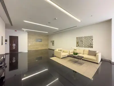 a living room with a couch and a table at Walk to JBR Beach I Marina Studio Stay I Wi-fi in Dubai