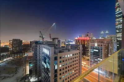 a view of a city at night with buildings at Chic Studio Near Burj Khalifa, Dubai Opera & Dubai Mall with City Skyline Views in Dubai