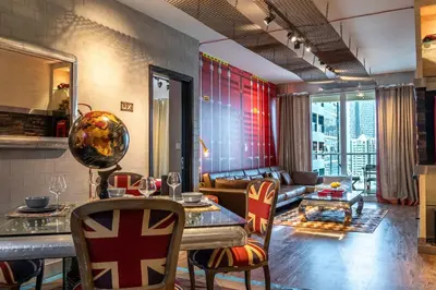 a living room with a couch and a table and chairs at Paradise of the Mind by Lagom in Dubai