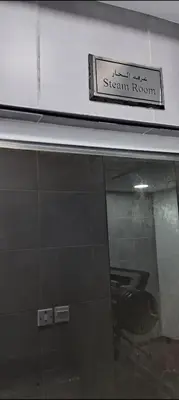 a sign for a steam room on top of a building at Luxury One Bedroom Apartment In Dubai Marina in Dubai