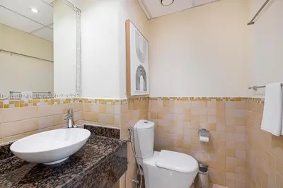 a bathroom with a sink and a toilet at Daniels 2BR at Rimal JBR with Marina View in Dubai