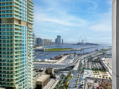 a view of a city from a tall building at Luxury Living in Emaar Beachfront w Private Beach in Dubai