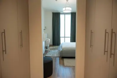 a room with a bedroom with a bed and a bathroom at Fabulous Canal Views Al Habtoor City in Dubai