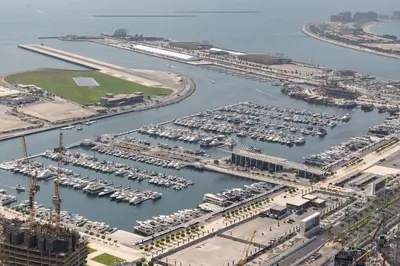 an aerial view of a marina with boats in the water at The Luxe Marina Experience - Stylish 2BR with Sweeping Balcony Views for Total Relaxation in Dubai