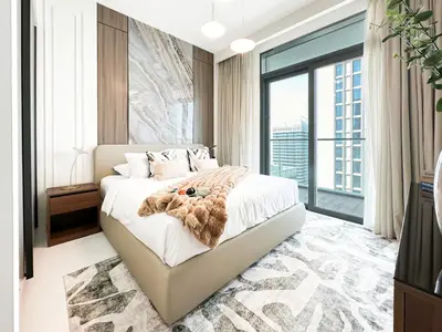 a bedroom with a large bed and a large window at Trophy Luxury 1BDR in Emaar Beach Front with Panoramic Sea Views from the Apartment and Private Beach Access in Dubai