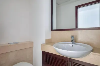 a bathroom with a sink and a toilet at Blueground The Residences gym parking DXB-1348 in Dubai