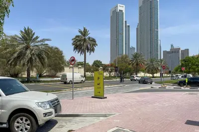 a white truck parked on a street in a city at Blueground DIFC Burj K views indoor pool DXB-1493 in Dubai