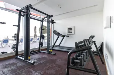 a gym with treadmills and bikes in a room at Binghatti Gateway Family 2BR with Balcony, Close to Dubai Mall & Burj Khalifa by Simply Comfort in Dubai