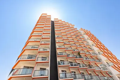 a tall building with many windows on it at Binghatti Gateway Family 2BR with Balcony, Close to Dubai Mall & Burj Khalifa by Simply Comfort in Dubai