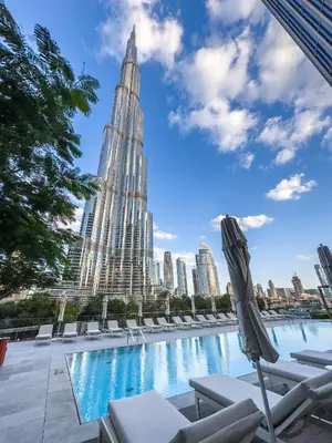 a swimming pool with a view of the chrysler building at Address Residence Opera, Downtown, Dubai in Dubai