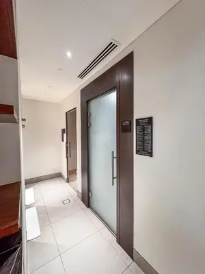 a hallway with a door in a building at Address Residence Opera, Downtown, Dubai in Dubai