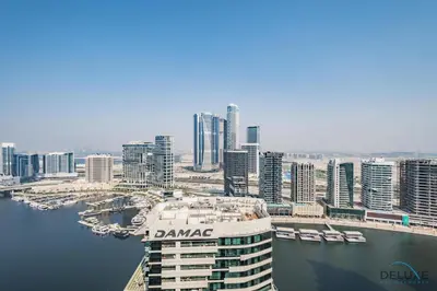 a view of a city with a cruise ship at Special Deal 2BR with Canal Views & Relaxing Balcony by Deluxe Holiday Homes in Dubai