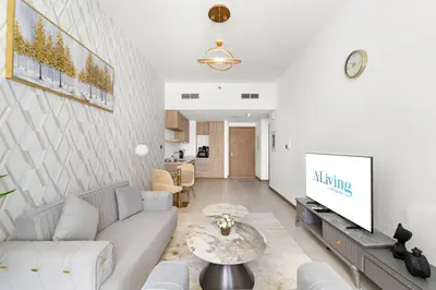 a living room with a couch and a tv at ALiving Classy 1BR I Near Burj Khalifa & Dubai Mall I Missoni Tower- 211 in Dubai