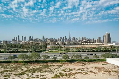 a view of a city from a parking lot at Burj Khalifa View Big terrace 1BR in Prime Views in Dubai