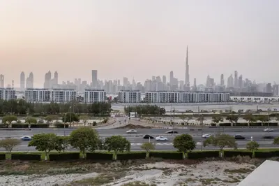 a view of a city with cars driving on a highway at Burj Khalifa View Big terrace 1BR in Prime Views in Dubai