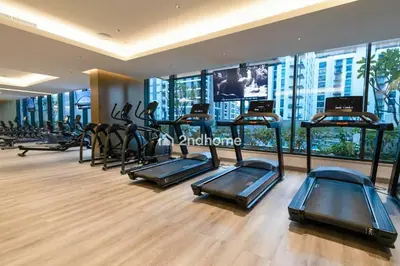 a gym with a bunch of treadmills in a building at Fully Equipped Residence at One Park Avenue in Dubai